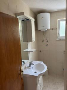 Kúpeľňa v ubytovaní Apartman Vučemil