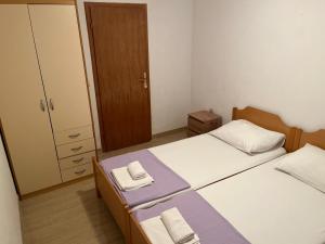 Posteľ alebo postele v izbe v ubytovaní Apartman Vučemil