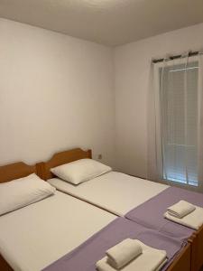 Posteľ alebo postele v izbe v ubytovaní Apartman Vučemil