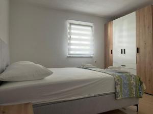 Posteľ alebo postele v izbe v ubytovaní Apartman Vučemil