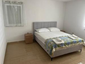 Posteľ alebo postele v izbe v ubytovaní Apartman Vučemil