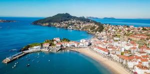 an aerial view of a town on a beach at Panxon in Nigrán