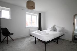 Katil atau katil-katil dalam bilik di Beaulieu Park - Sleeps 10 - Chelmsford +8 gambar