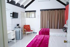 Letto o letti in una camera di AYURVEDA RESORT