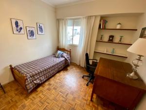 a bedroom with a bed and a desk and a desk at Barrio Norte Luxury Apartment for 2/4 in Buenos Aires