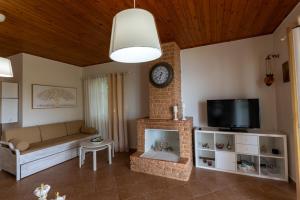 TV a/nebo společenská místnost v ubytování Country House Hortensia