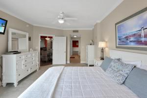 a large bedroom with a bed and a dresser at Paradise Shores 310 by Pristine Properties Vacation Rentals in Mexico Beach