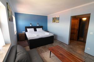 Postel nebo postele na pokoji v ubytování Taverna & Rooms