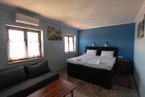 Postel nebo postele na pokoji v ubytování Taverna & Rooms
