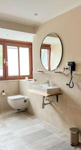a bathroom with a sink and a mirror at Bacharacher Hof in Bacharach
