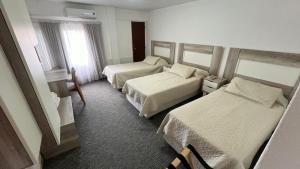 Postel nebo postele na pokoji v ubytování Hotel Plaza Formosa