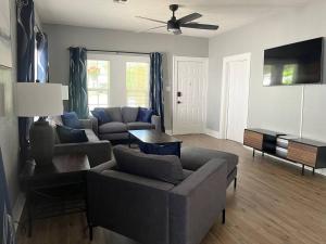 a living room with two couches and a tv at Old Town Charm with 2 Bedrooms, 3 TVs in Lawton