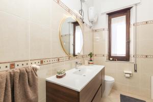 a bathroom with a sink and a mirror at Nonna ADELINA a 150 m da Cala Moresca in Àrbatax +28 photos