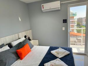 En eller flere senge i et værelse på Flat 427 confortável na Passagem à 700m da praia + 35 billeder