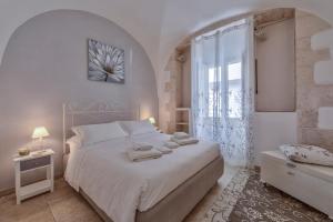 Letto o letti in una camera di Borgo Diaz