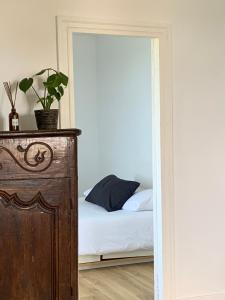 a bedroom with a bed and a door with a mirror at Villa Anvers Guethary in Bidart +28 photos