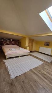 a attic room with two beds and a window at Apartament ultra central! in Iaşi