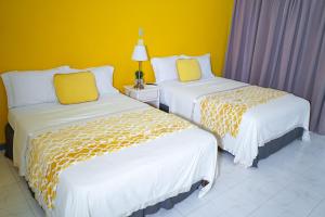 Letto o letti in una camera di AYURVEDA RESORT