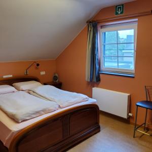En eller flere senger på et rom på Holiday Home LIMBURG LILLO IRENE