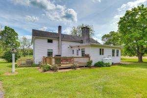 an old white house with a large yard at Historic Farmhouse in Layton with Deck! in Layton