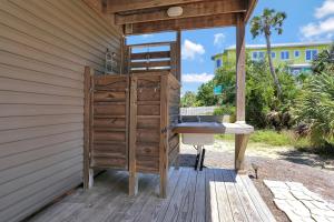 a wooden bathroom with a sink on a deck at Sweet Destiny by Pristine Properties Vacation Rentals in Indian Pass