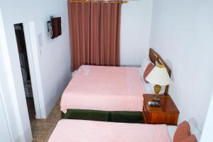 Letto o letti in una camera di AYURVEDA RESORT