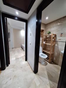 a bathroom with a toilet and a sink at Casa Home in Casablanca