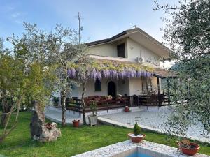 a house with purple wreaths on the front of it at Relais 5 Sensi WELLNESS & SPA in Bagnoli Irpino
