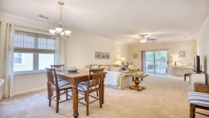 a living room with a table and a couch at 321 Willow Bend condo in North Myrtle Beach