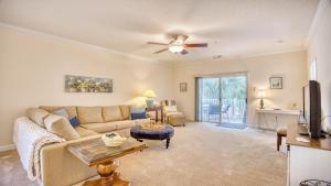 a living room with a couch and a tv at 321 Willow Bend condo in North Myrtle Beach +21 photos
