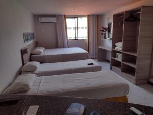 Postel nebo postele na pokoji v ubytování Ambassador Unidades Autônomas + 69 fotografií