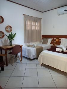 Postel nebo postele na pokoji v ubytování Pousada Sombra do Cajueiro