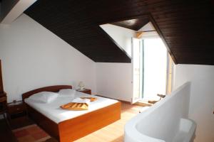 Postel nebo postele na pokoji v ubytování Apartments Mimoza