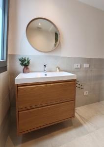 a bathroom with a sink and a mirror at Casa Maribella Cattolica in Cattolica +12 photos