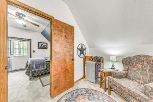 a living room with a couch and a chair at Quaint Cloudcroft Cabin with Stunning Forest Views! in Cloudcroft +28 photos