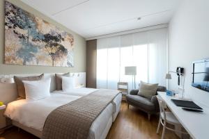 Postel nebo postele na pokoji v ubytování WestCord Hotel Delft