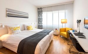 Postel nebo postele na pokoji v ubytování WestCord Hotel Delft