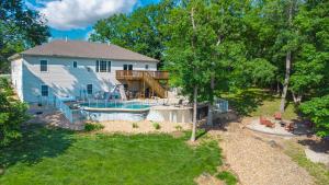 an aerial view of a house with a water park at Private Pool Vacation Home in Lake Ozark
