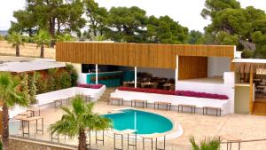 a villa with a swimming pool and a resort at SANIMAR By Mono Alex in Kassandra