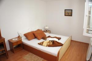 Postel nebo postele na pokoji v ubytování Apartments Mimoza