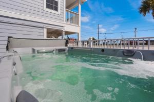 a swimming pool in the backyard of a house at Good Day Sunshine by Pristine Properties Vacation Rentals in Mexico Beach