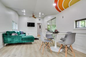 a living room with a green couch and chairs at Single-Story Cabin on Hyco Lake Swim and Unwind! in Semora