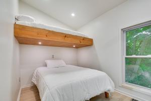 a bedroom with a bunk bed and a window at Single-Story Cabin on Hyco Lake Swim and Unwind! in Semora