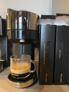 Comodidades para preparar café e chá em EJ Boutique Suites