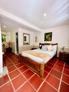 Un pat sau paturi într-o cameră la Santuario Tayrona Hostel