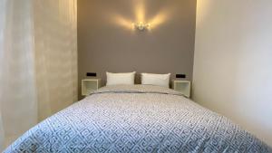 Posteľ alebo postele v izbe v ubytovaní RABAT RESIDENCE - Apartments