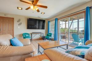 a living room with two couches and a table at Family-Friendly Fischer Home with Private Hot Tub! in Fischer