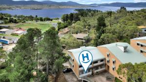 an aerial view of a building with a parking lot at Kirwan 19 in Jindabyne