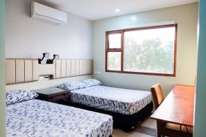 Кровать или кровати в номере Level 007 Hotels and Resorts Inc