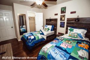 a bedroom with two twin beds and a bedskirts at “Home Away From Home” ( HAFH) in Baton Rouge